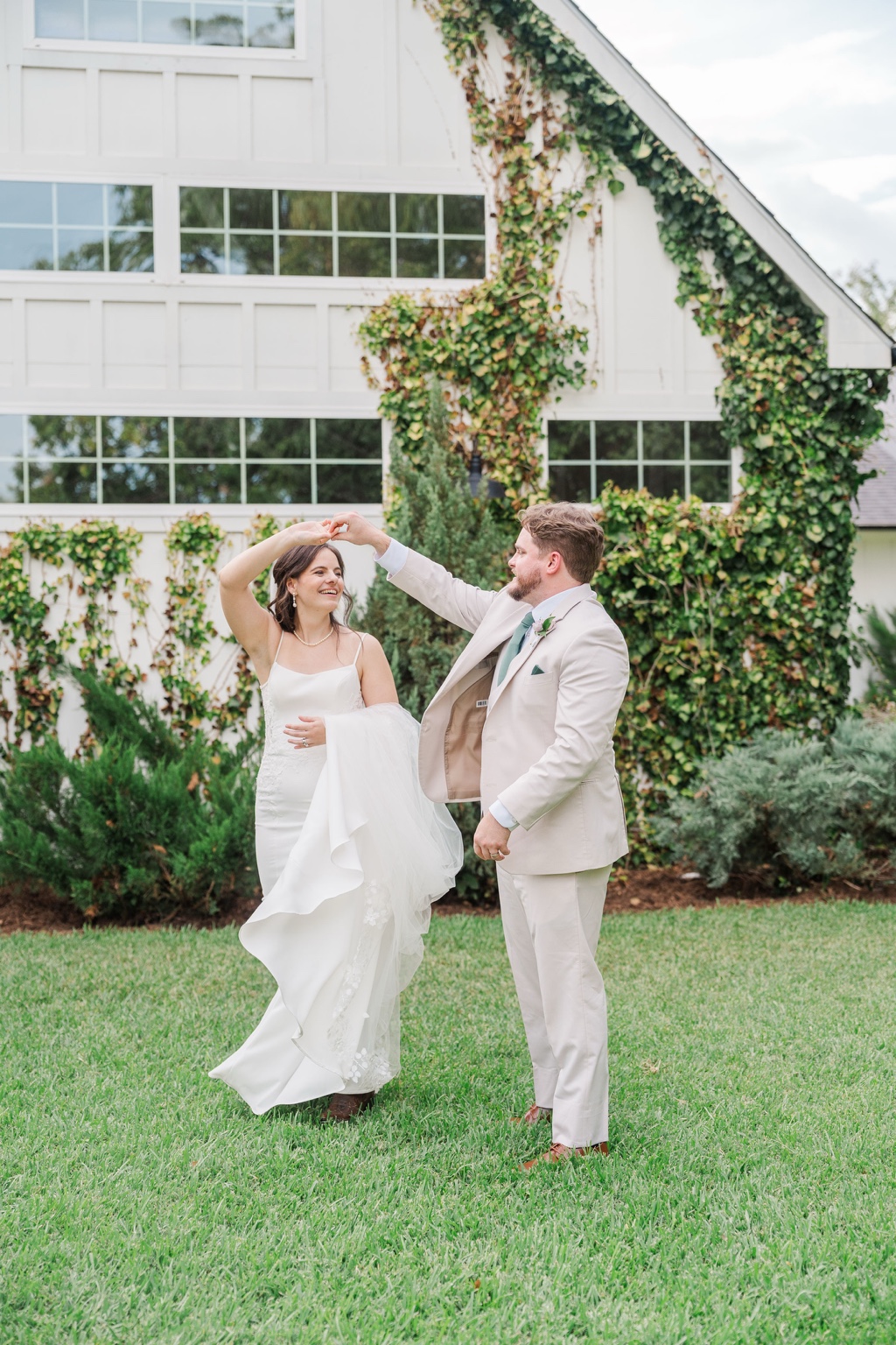 Paige and Charles twirling together on their wedding day